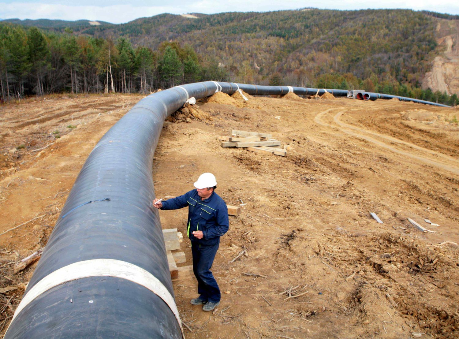 Worker inspects a pipeline that is part of the Sakhalin-2 project north of Yuzhno-Sakhalinsk
